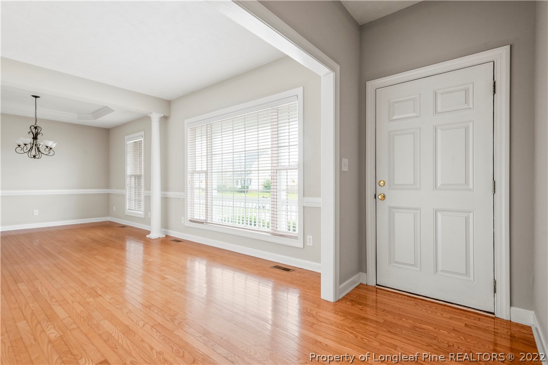 3612 Talus Road Fayetteville, NC 28306 - Photo 7 of 29 wooden floor in an empty room with a window