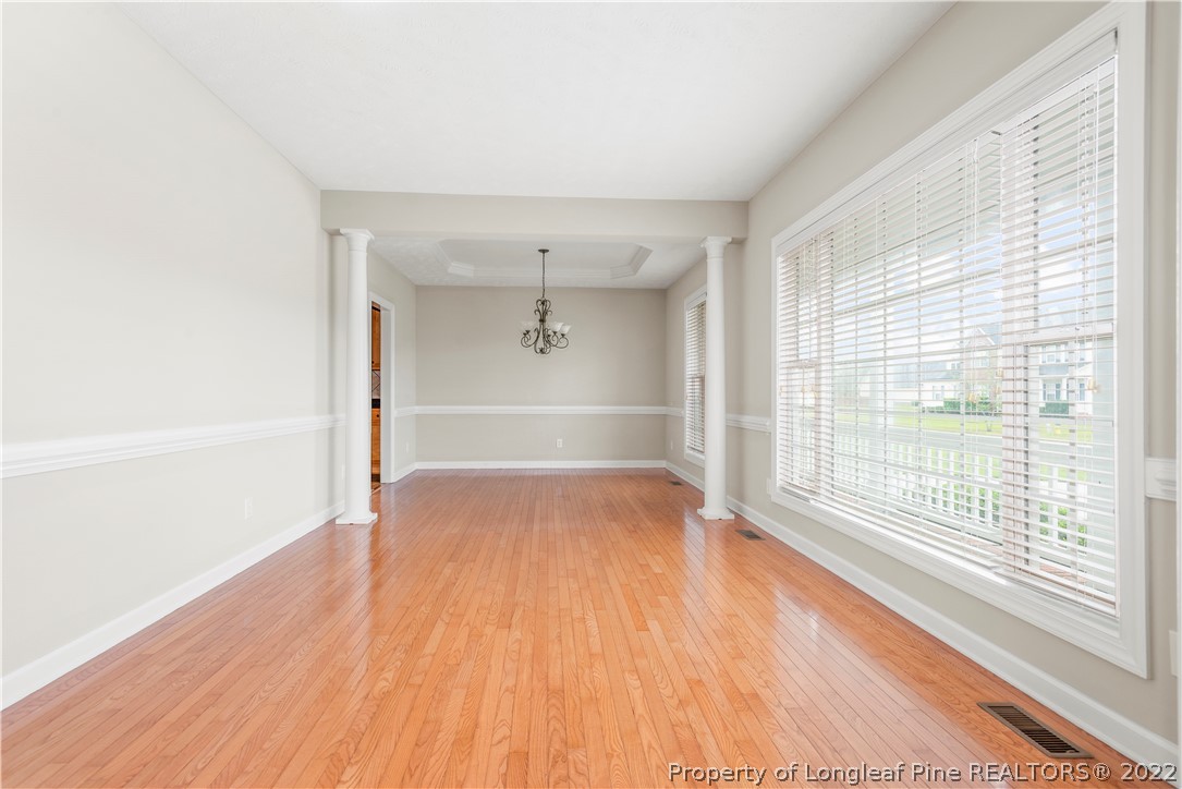 3612 Talus Road Fayetteville, NC 28306 - Photo 8 of 29 a view of an empty room with wooden floor and a window