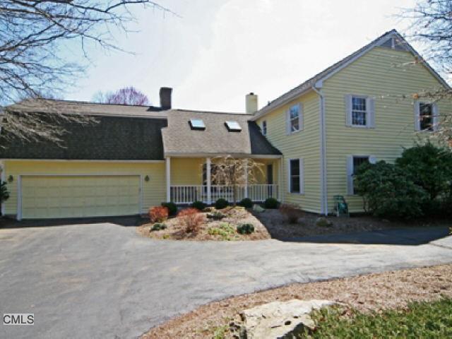 a front view of a house with garage