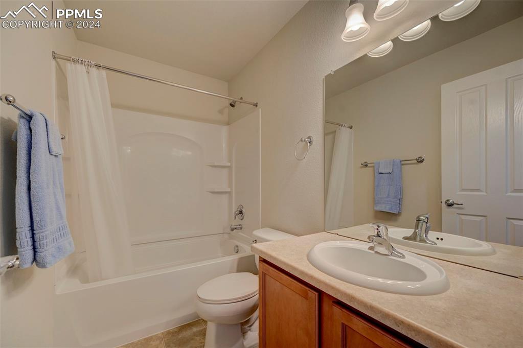 7675 Sandy Springs Point Fountain, CO 80817 - Photo 22 of 32 a bathroom with a sink toilet and shower