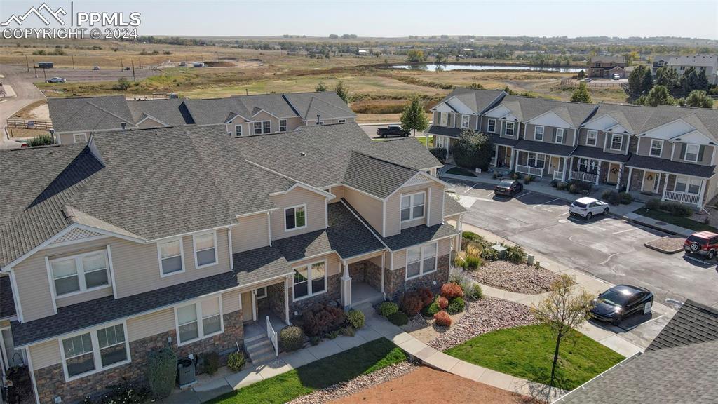 7675 Sandy Springs Point Fountain, CO 80817 - Photo 30 of 32 an aerial view of a house with a lake view