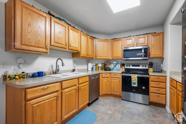 8196 North Cedar Springs Road, Unit 2 Eagle Mountain, UT 84005 - Photo 7 of 22 Kitchen featuring appliances with stainless steel finishes and light countertops