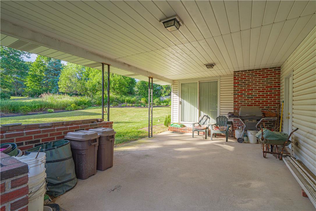 5425 Clauser Road Orefield, PA 18069 - Photo 8 of 18 A spacious covered patio offers a comfortable outdoor living area with verdant views.