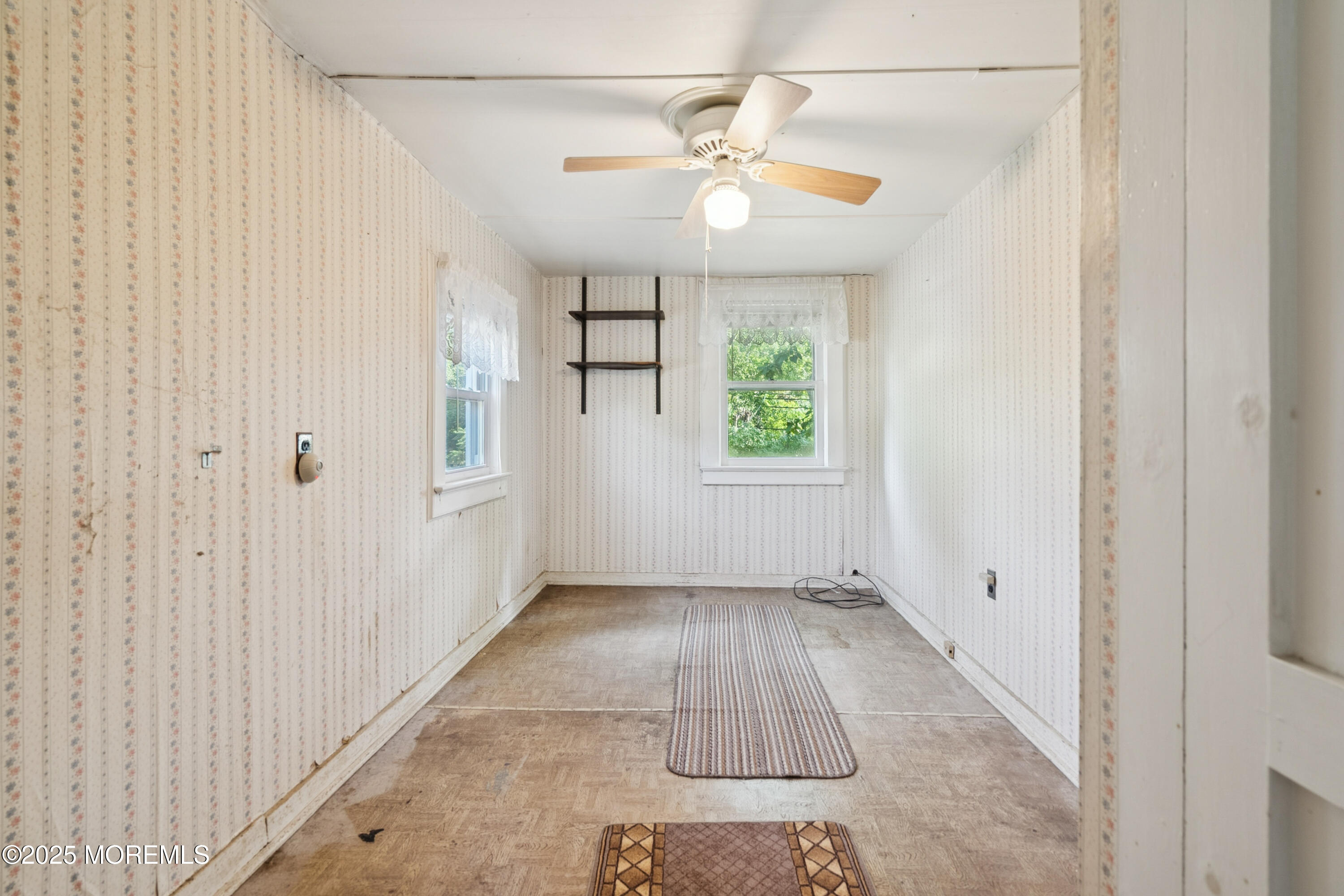 2628 East Hurley Pond Road Wall, NJ 07719 - Photo 13 of 40 an empty room with windows and closet