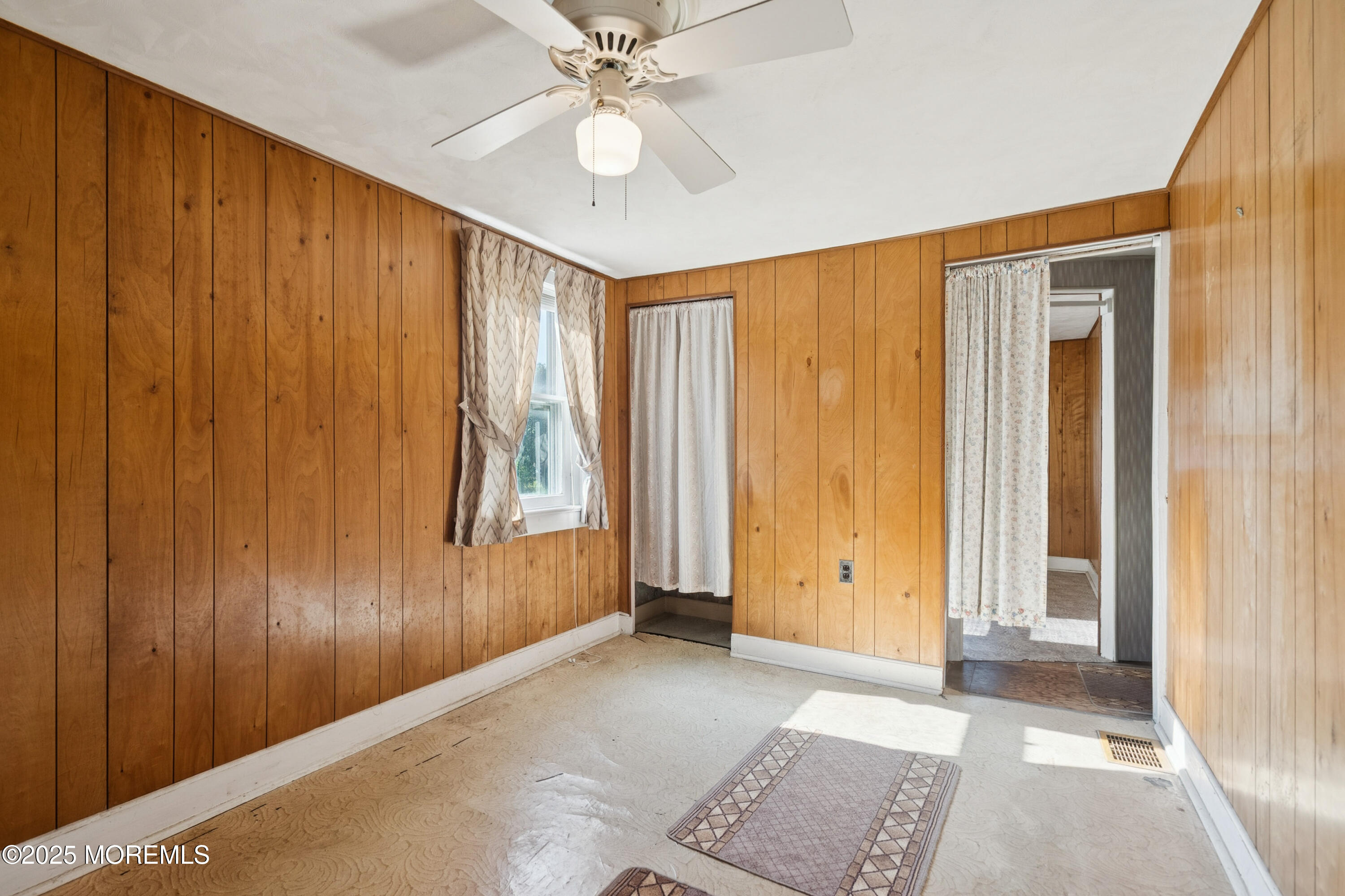 2628 East Hurley Pond Road Wall, NJ 07719 - Photo 17 of 40 an empty room with windows and closet area