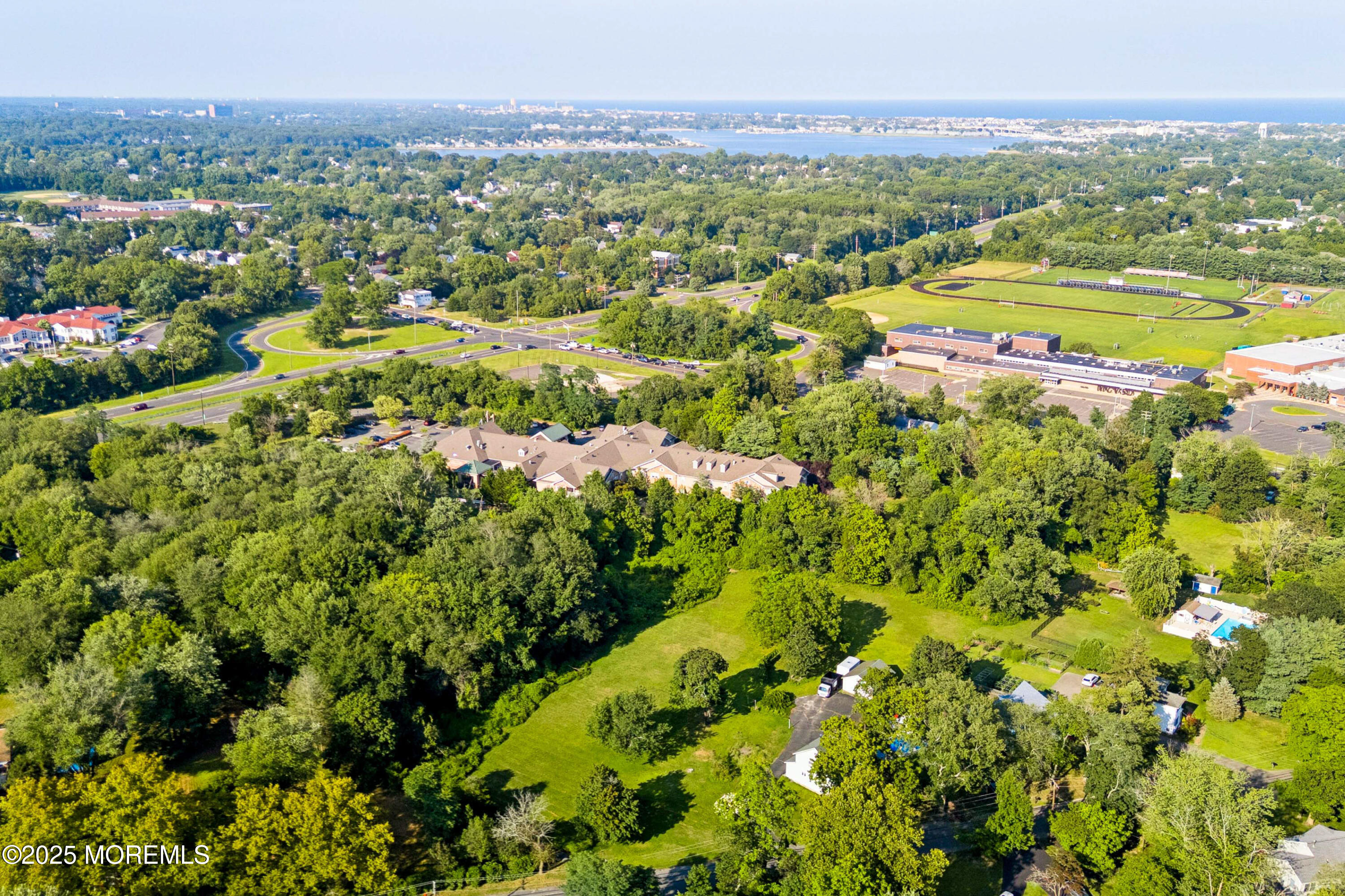 2628 East Hurley Pond Road Wall, NJ 07719 - Photo 21 of 40 a view of a city with lush green forest