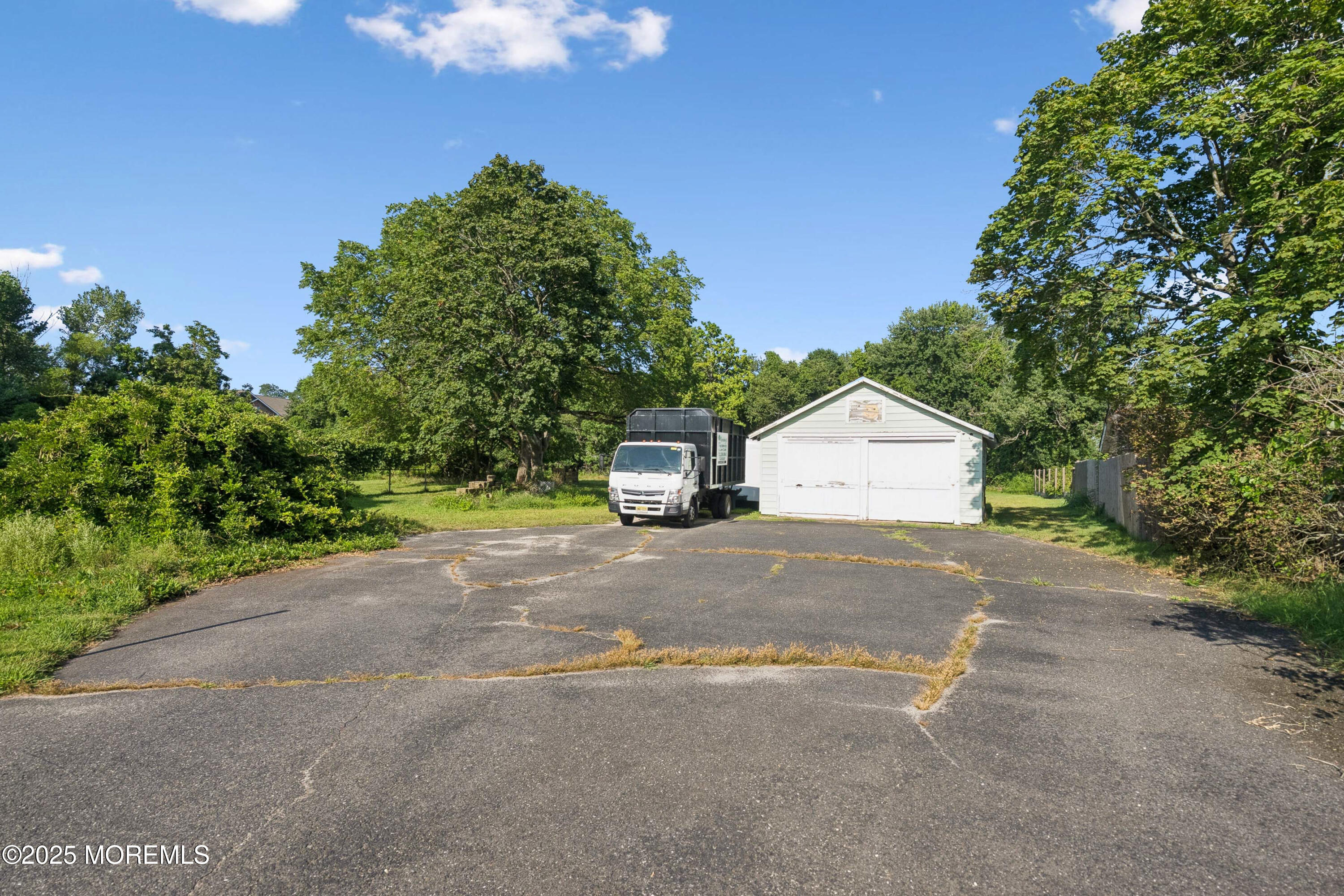 2628 East Hurley Pond Road Wall, NJ 07719 - Photo 22 of 40 a car parked on the side of the road