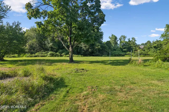 a view of a house with a big yard