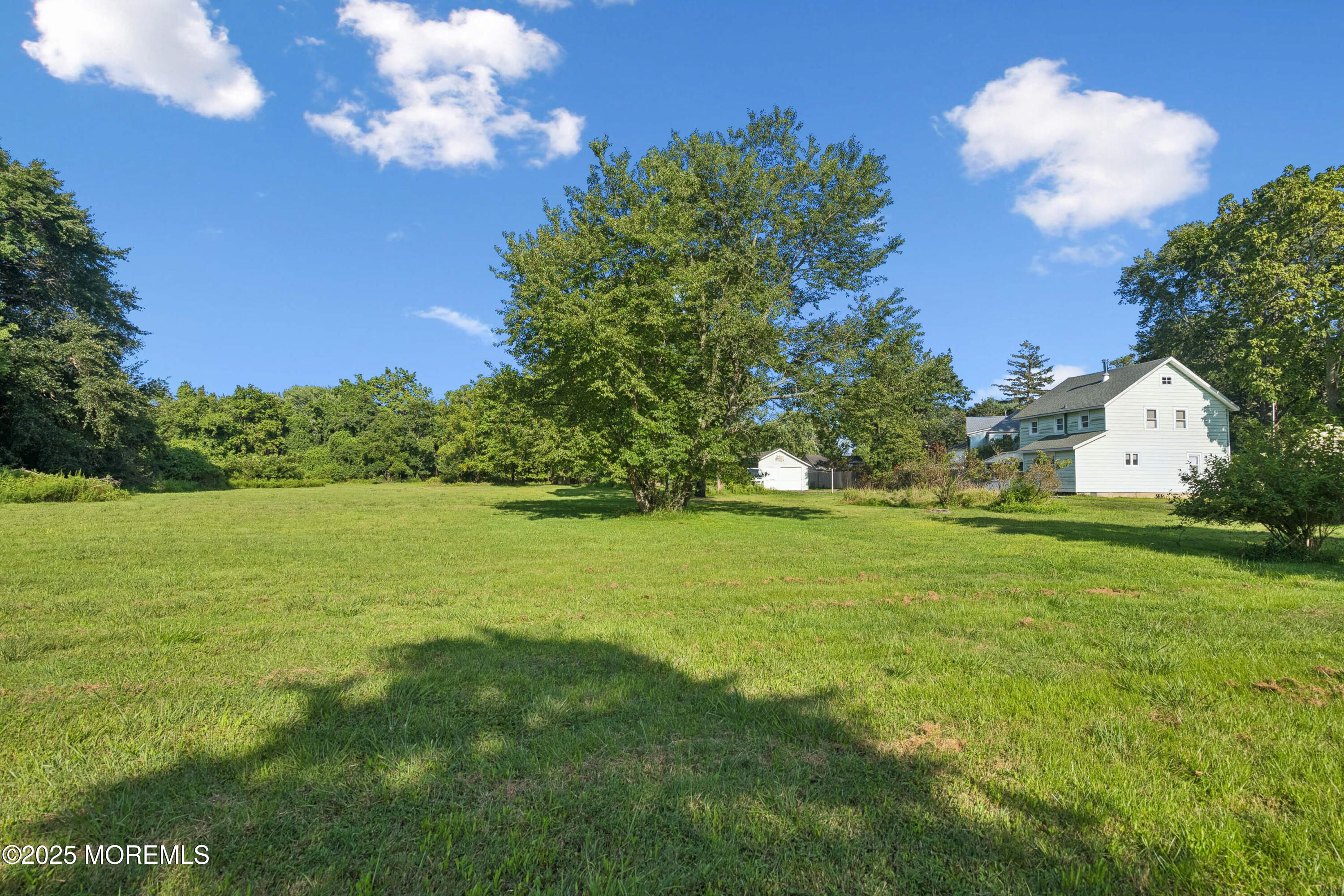 2628 East Hurley Pond Road Wall, NJ 07719 - Photo 25 of 40 a view of a house with a big yard