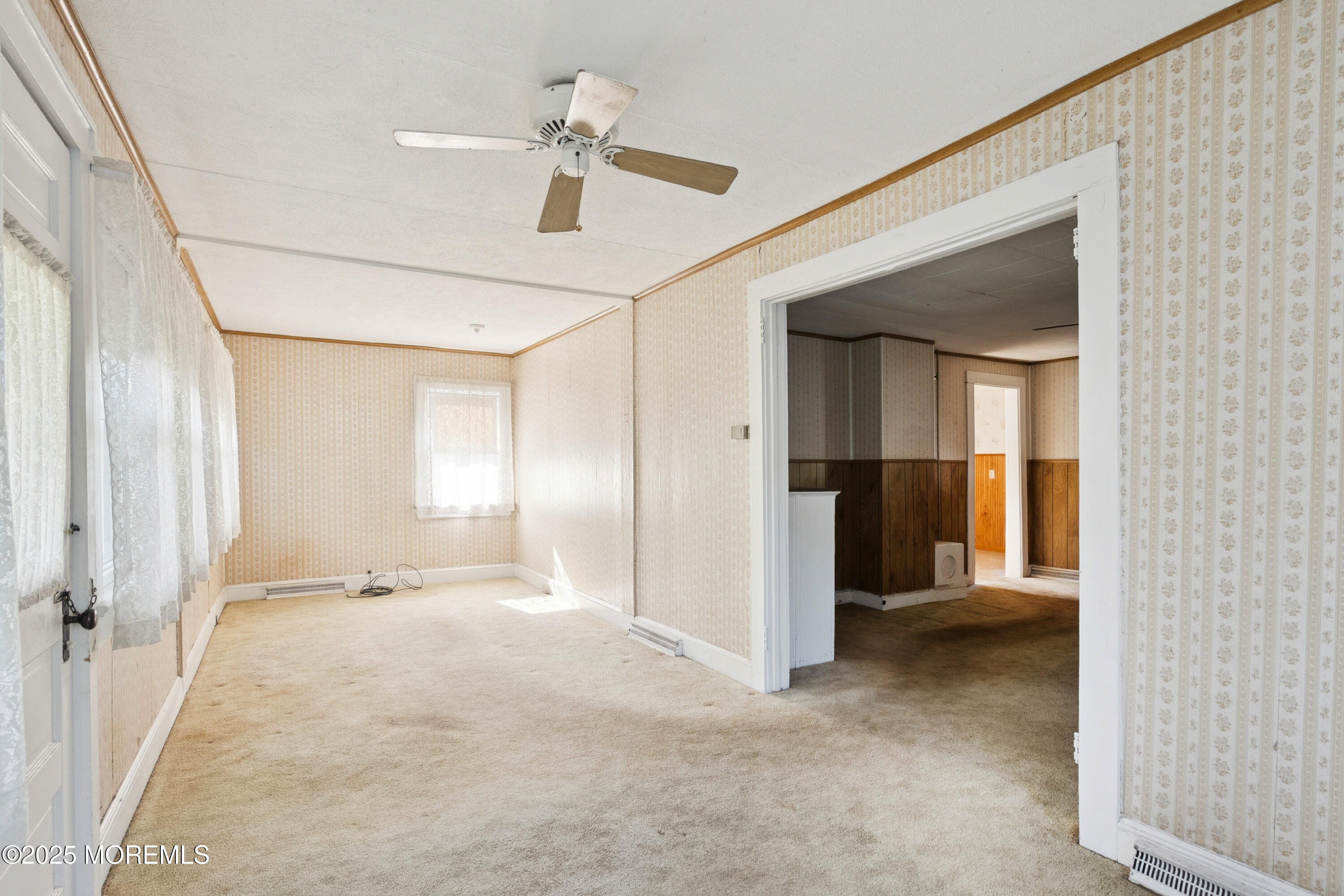 2628 East Hurley Pond Road Wall, NJ 07719 - Photo 3 of 40 a view of a livingroom with a staircase