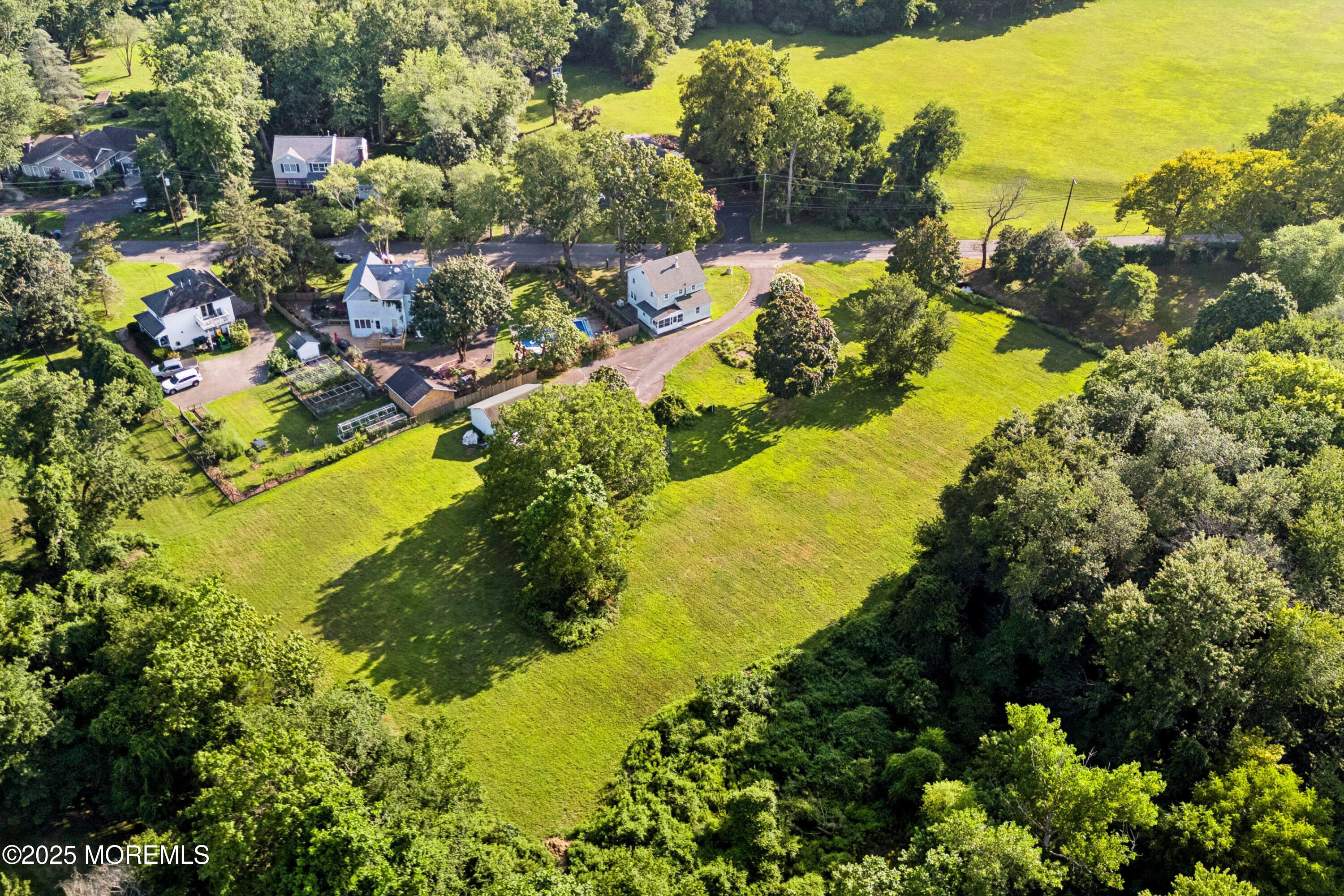 2628 East Hurley Pond Road Wall, NJ 07719 - Photo 33 of 40 a view of a lake with boats and trees all around