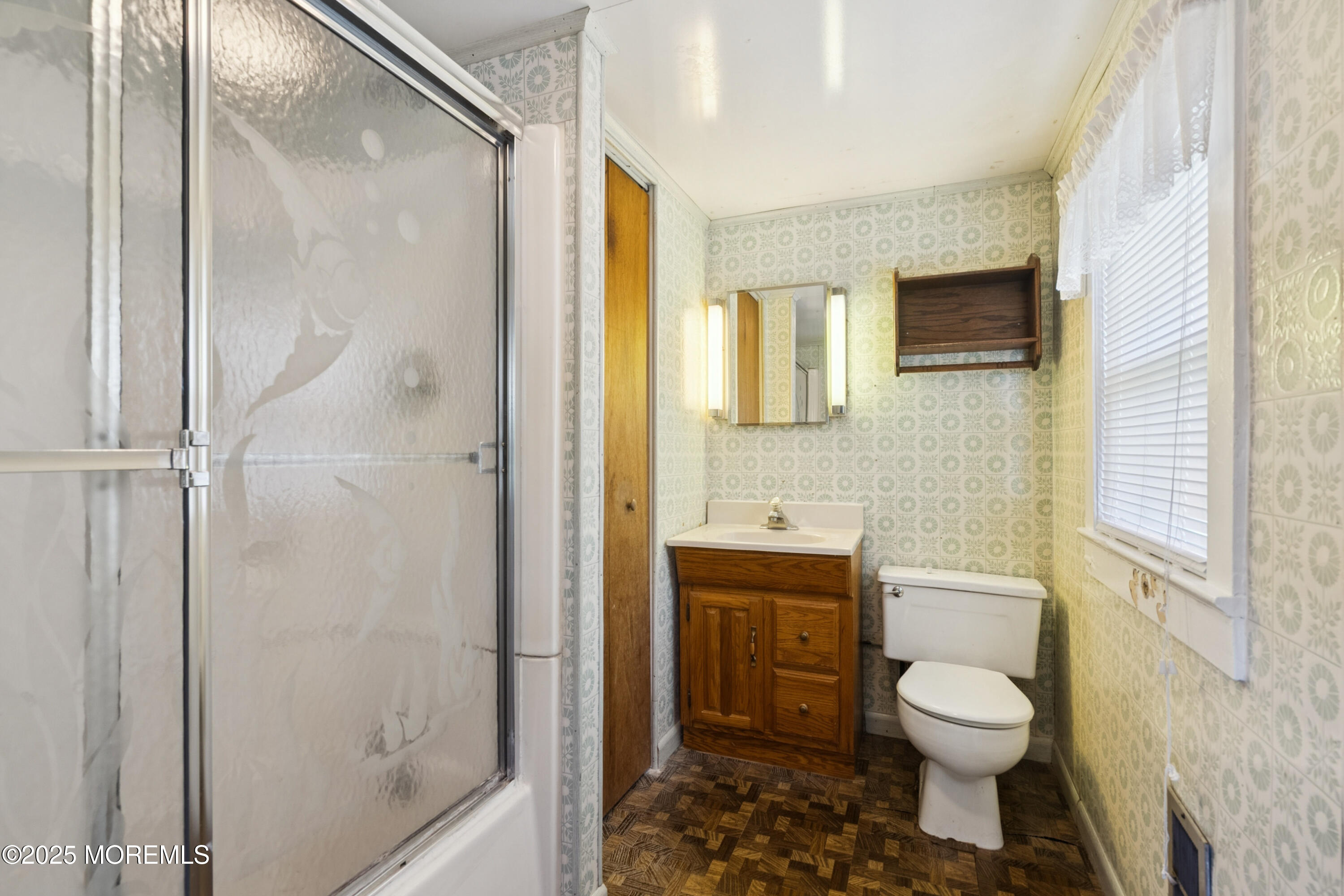 2628 East Hurley Pond Road Wall, NJ 07719 - Photo 34 of 40 a bathroom with a toilet a sink and shower