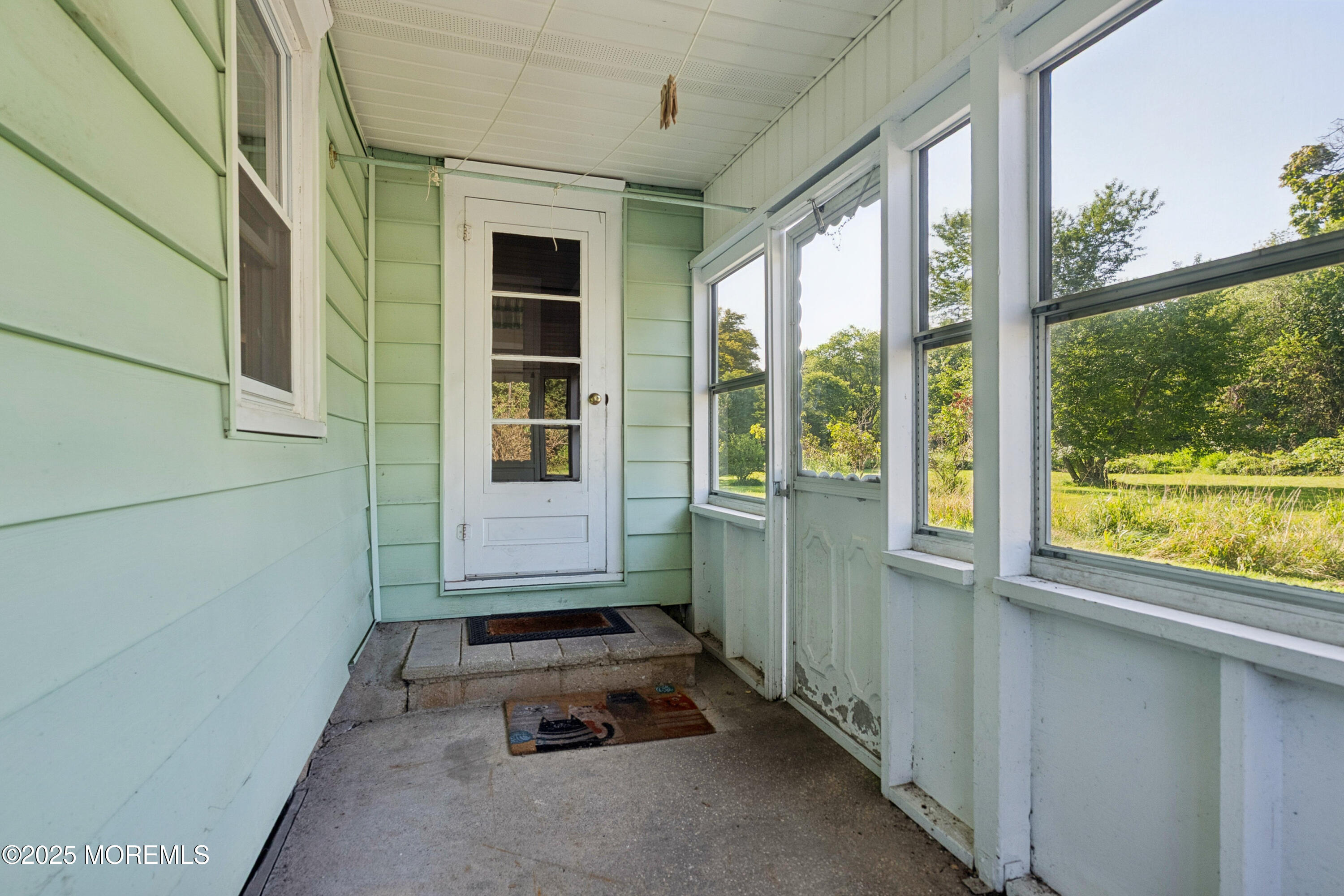 2628 East Hurley Pond Road Wall, NJ 07719 - Photo 35 of 40 an empty room with windows