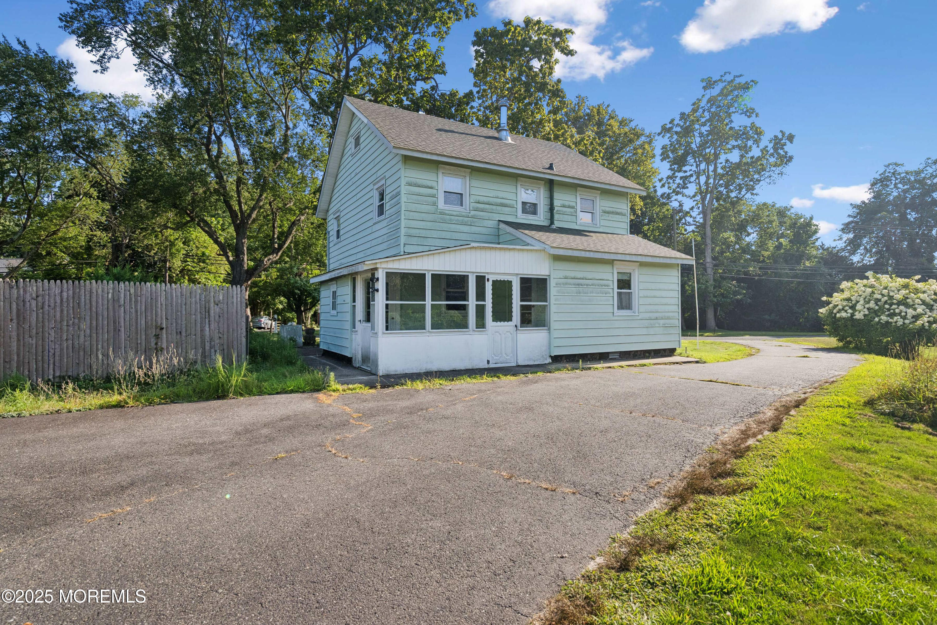 2628 East Hurley Pond Road Wall, NJ 07719 - Photo 37 of 40 a view of a house with backyard and trees