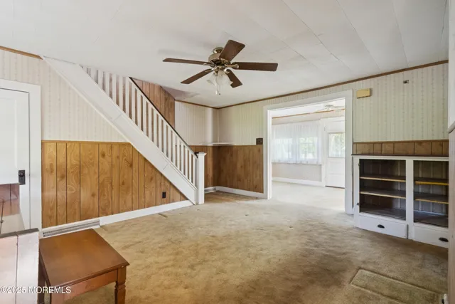 a view of a livingroom with a staircase