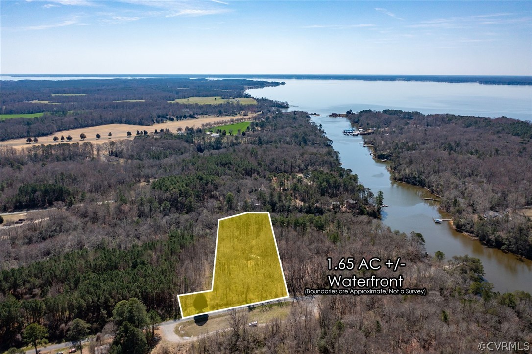 0 Thomas Landing Road Lancaster, VA 22503 - Photo 4 of 44 a view of a lake with a mountain