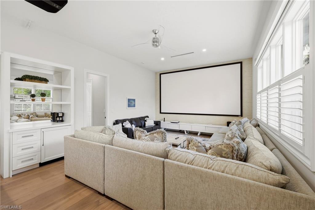 215 3rd Avenue North Naples, FL 34102 - Photo 23 of 47 Cinema room with recessed lighting, light wood-type flooring, and a ceiling fan