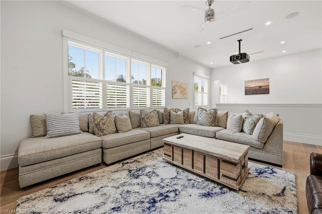 215 3rd Avenue North Naples, FL 34102 - Photo 24 of 47 Living room with wood finished floors, a ceiling fan, and recessed lighting