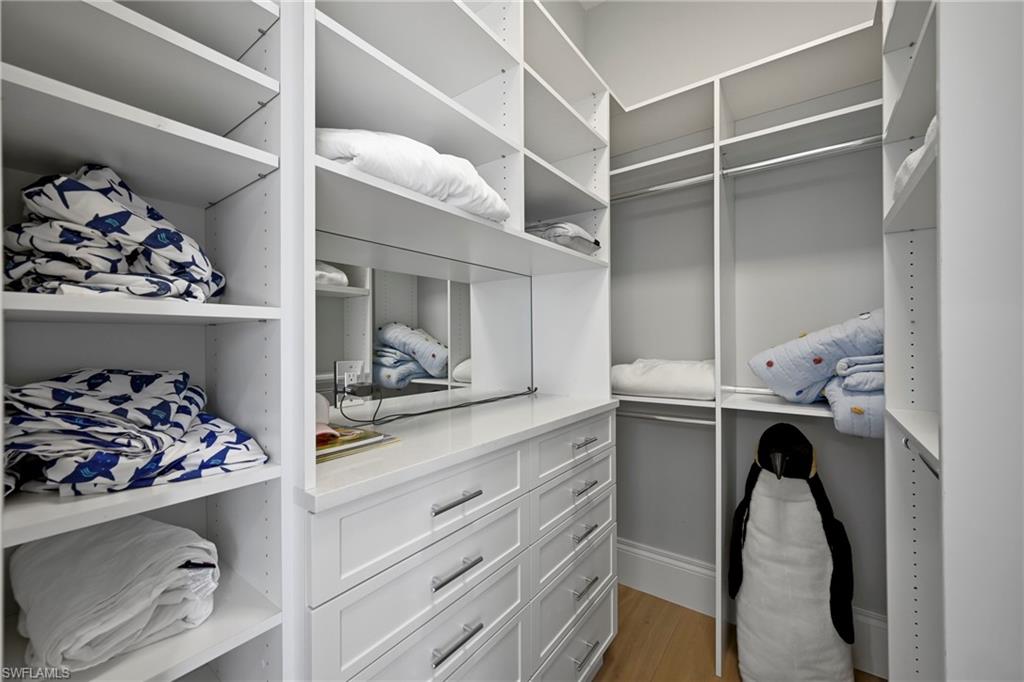 215 3rd Avenue North Naples, FL 34102 - Photo 29 of 47 Walk in closet featuring light wood-type flooring