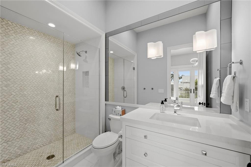 215 3rd Avenue North Naples, FL 34102 - Photo 30 of 47 Bathroom featuring vanity, a shower stall, and recessed lighting
