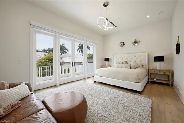 a spacious bedroom with a bed and a couch