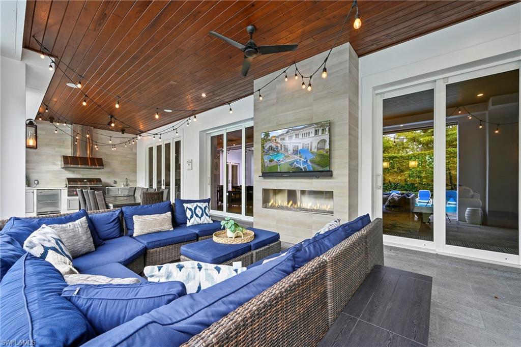 215 3rd Avenue North Naples, FL 34102 - Photo 37 of 47 View of patio / terrace featuring an outdoor kitchen and area to lounge and ceiling fan