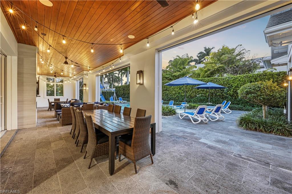 215 3rd Avenue North Naples, FL 34102 - Photo 38 of 47 View of patio / terrace with outdoor dining space