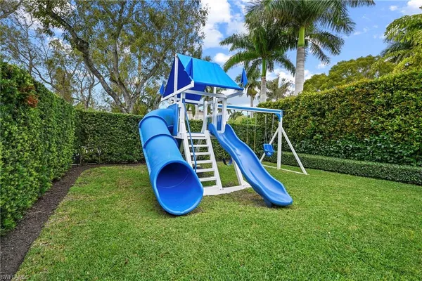 a view of a backyard with a slide and a slide