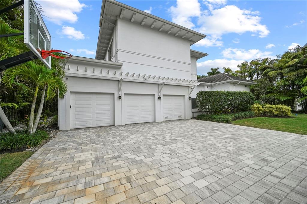 215 3rd Avenue North Naples, FL 34102 - Photo 47 of 47 Garage with decorative driveway