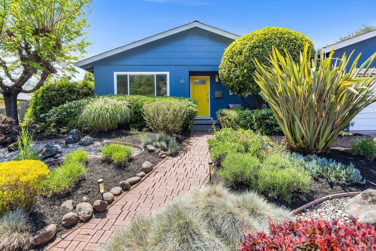 a front view of a house with garden