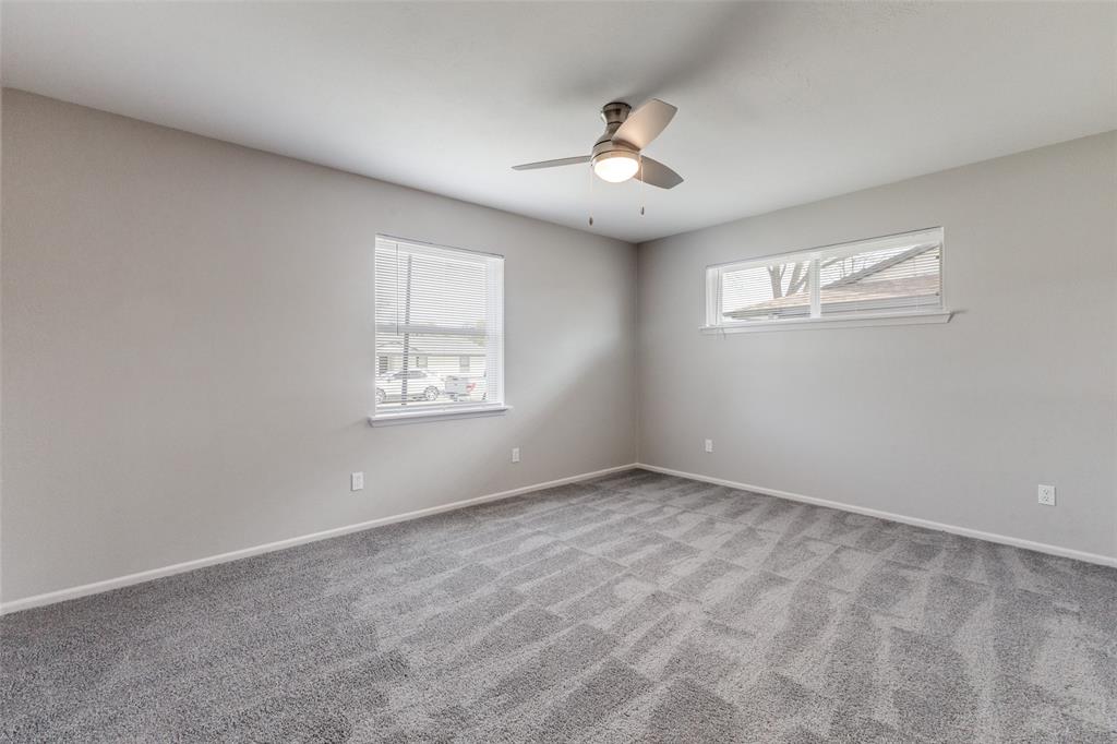 3406 Blue Ridge Lane Garland, TX 75042 - Photo 20 of 25 wooden floor in an empty room with a window