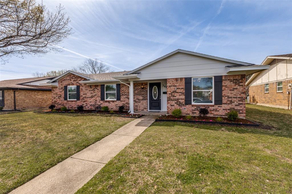3406 Blue Ridge Lane Garland, TX 75042 - Photo 2 of 25 a front view of a house with a garden and porch