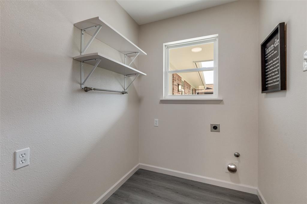 3406 Blue Ridge Lane Garland, TX 75042 - Photo 22 of 25 an empty room with a window and wooden floor