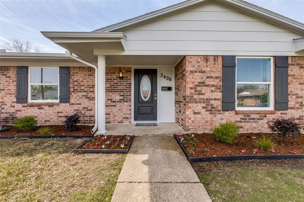 3406 Blue Ridge Lane Garland, TX 75042 - Photo 3 of 25 a front view of a house with a yard
