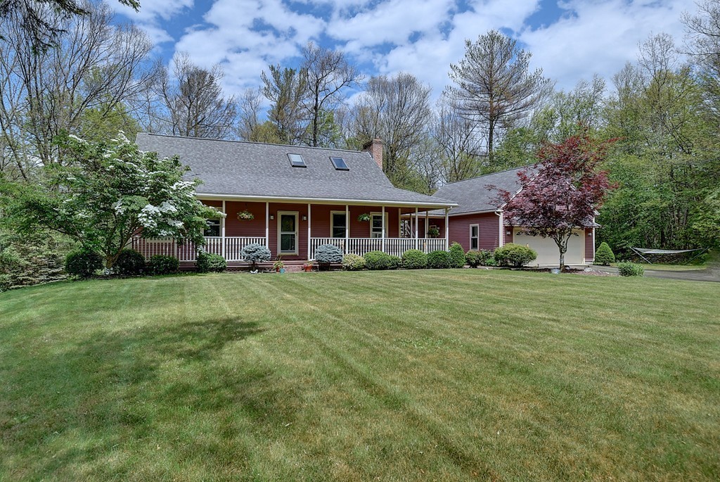 126 Wales Road Holland, MA 01521 - Photo 1 of 24 a front view of a house with a garden