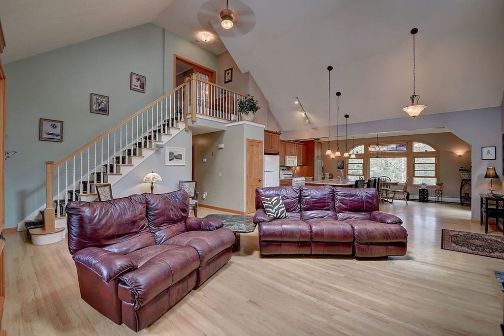 126 Wales Road Holland, MA 01521 - Photo 11 of 24 a living room with furniture a ceiling fan and a rug