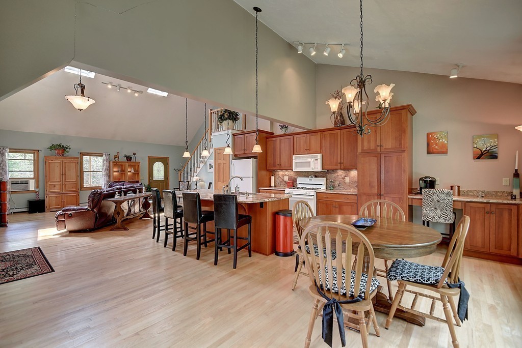 126 Wales Road Holland, MA 01521 - Photo 12 of 24 a view of a dining room with furniture and chandelier