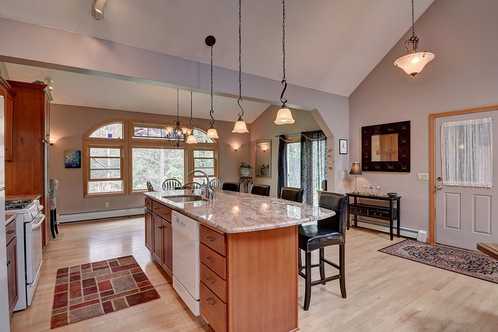 126 Wales Road Holland, MA 01521 - Photo 14 of 24 a open kitchen with stainless steel appliances granite countertop a stove and a sink