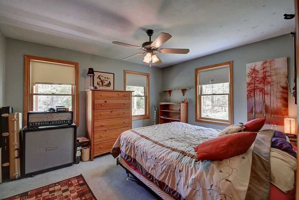 126 Wales Road Holland, MA 01521 - Photo 16 of 24 a bedroom with a bed and wooden floor