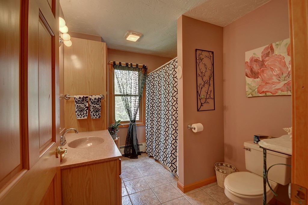 126 Wales Road Holland, MA 01521 - Photo 17 of 24 a bathroom with a sink toilet and shower