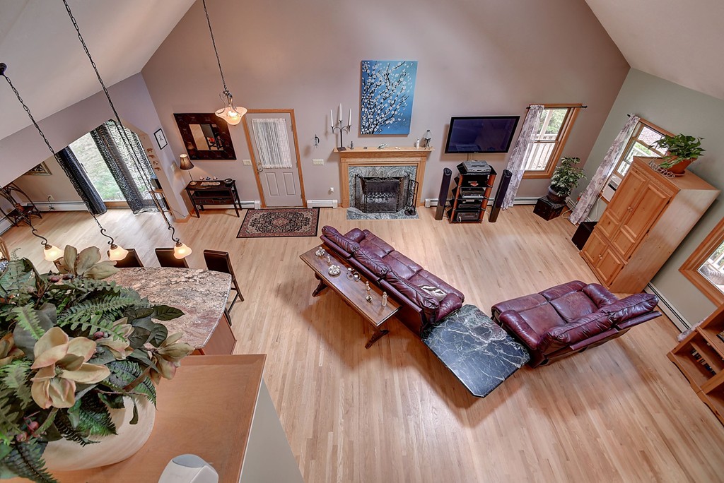 126 Wales Road Holland, MA 01521 - Photo 20 of 24 a living room with furniture and a fireplace