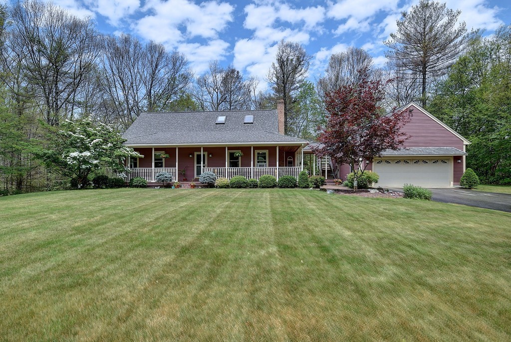 126 Wales Road Holland, MA 01521 - Photo 2 of 24 a front view of a house with a yard
