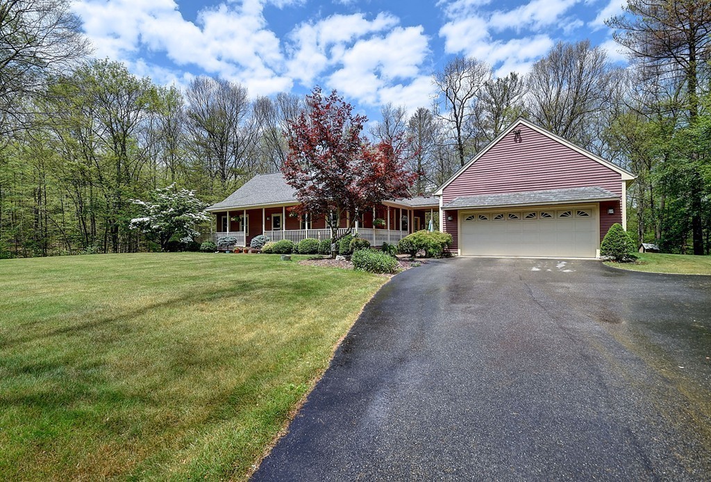 126 Wales Road Holland, MA 01521 - Photo 3 of 24 a front view of a house with garden