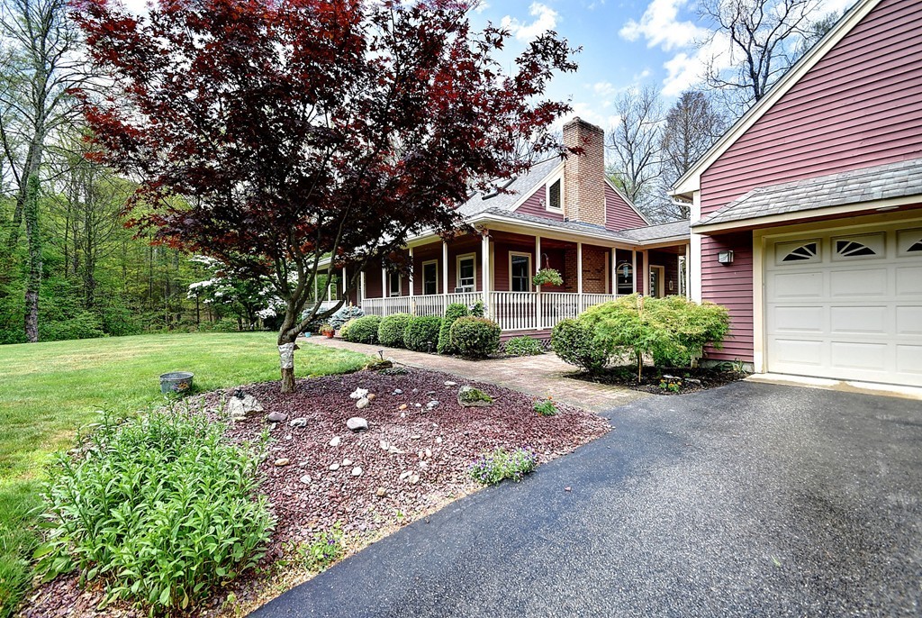 126 Wales Road Holland, MA 01521 - Photo 4 of 24 a front view of a house with a garden