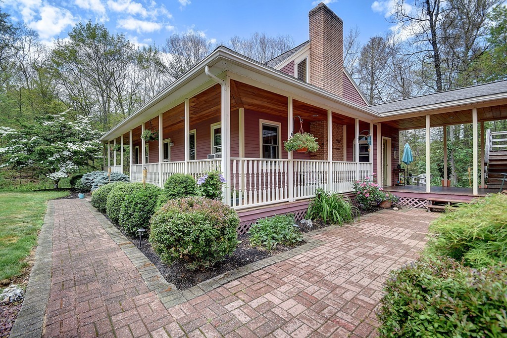 126 Wales Road Holland, MA 01521 - Photo 5 of 24 a front view of a house with garden