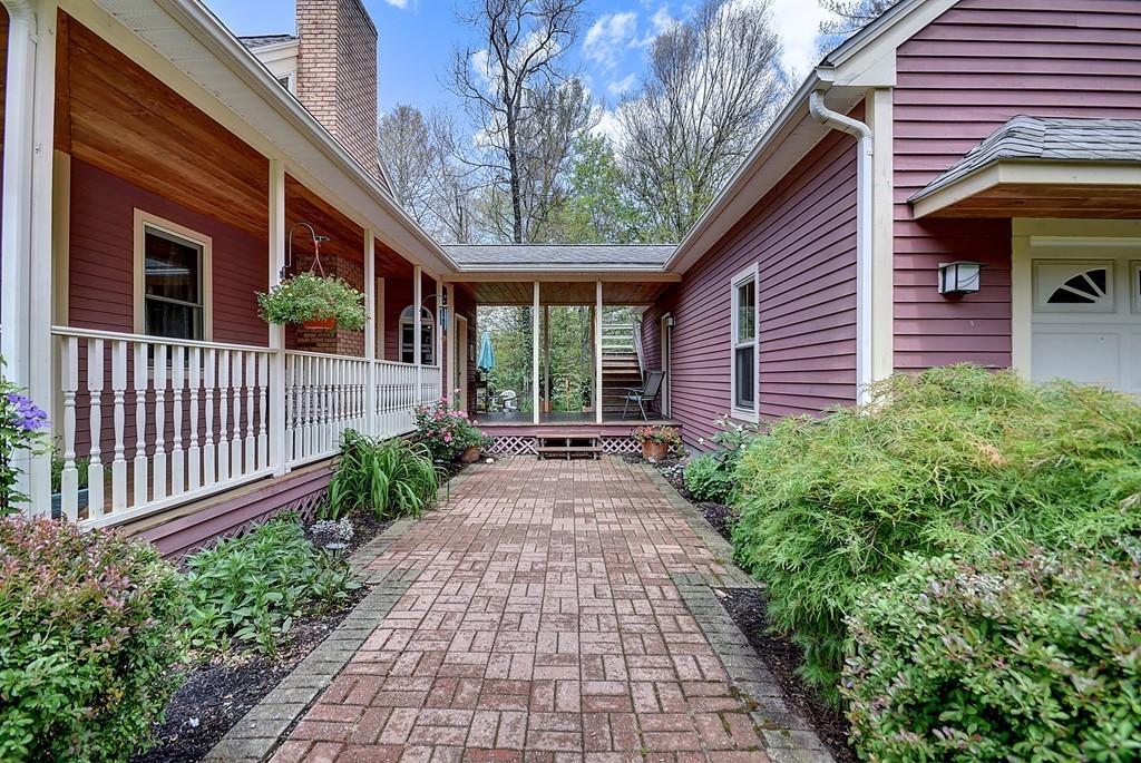 126 Wales Road Holland, MA 01521 - Photo 6 of 24 a view of a pathway with a house