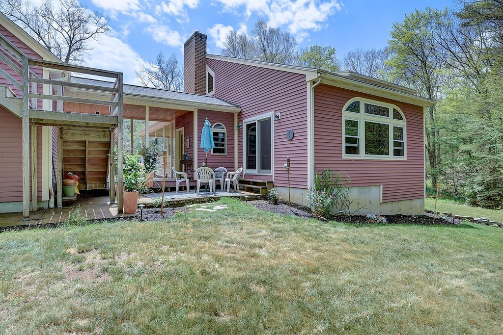 126 Wales Road Holland, MA 01521 - Photo 7 of 24 a view of a house with backyard