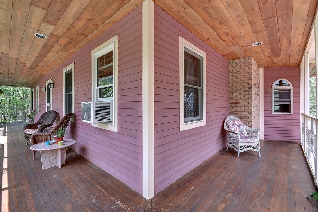 126 Wales Road Holland, MA 01521 - Photo 8 of 24 a wooden bench sitting in front of a building