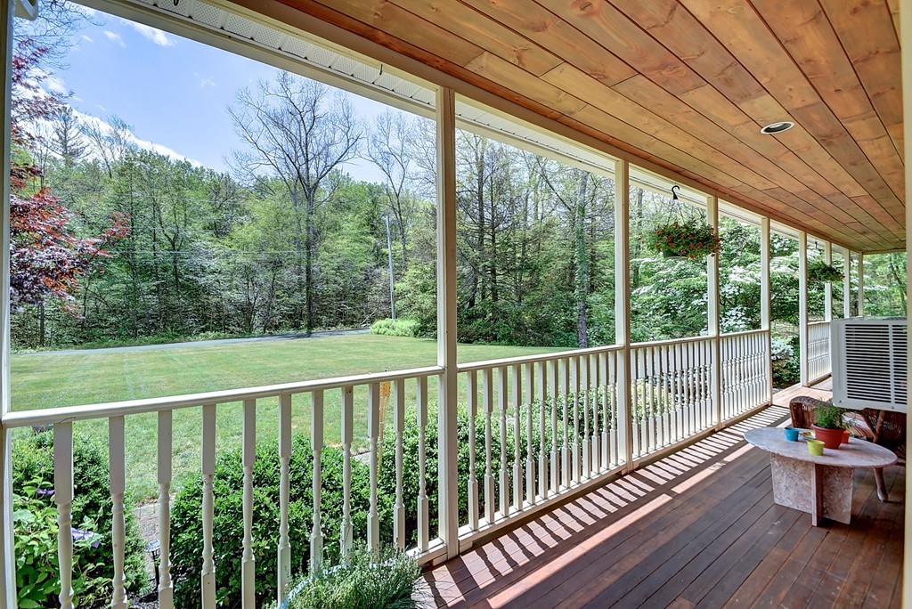 126 Wales Road Holland, MA 01521 - Photo 9 of 24 a view of a wooden deck next to a yard