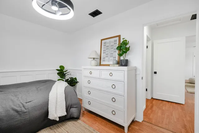 a living room with furniture and potted plant
